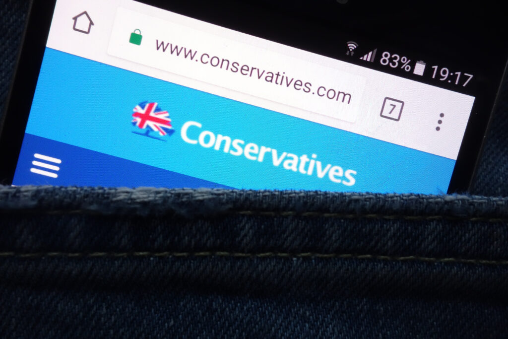 The,Conservatives,Political,Party,Website,Displayed,On,Smartphone,Hidden,In