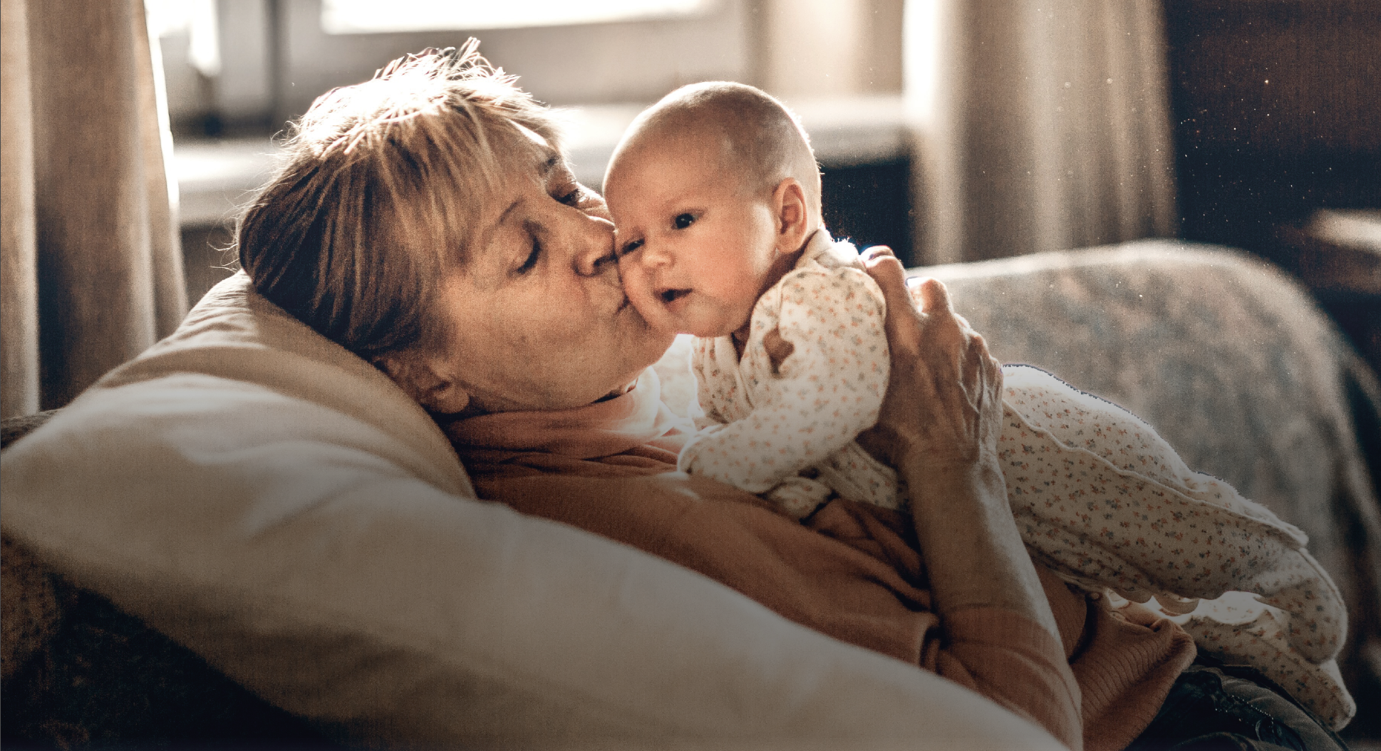 A woman holding a baby.