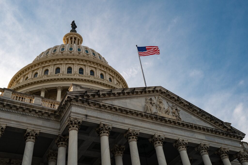 US lawmakers introduce bill to target the paedophile enabling surrogacy industry Washington,Dc.,National,Capitol,Building,With,Us,Flag.,Us,Government.