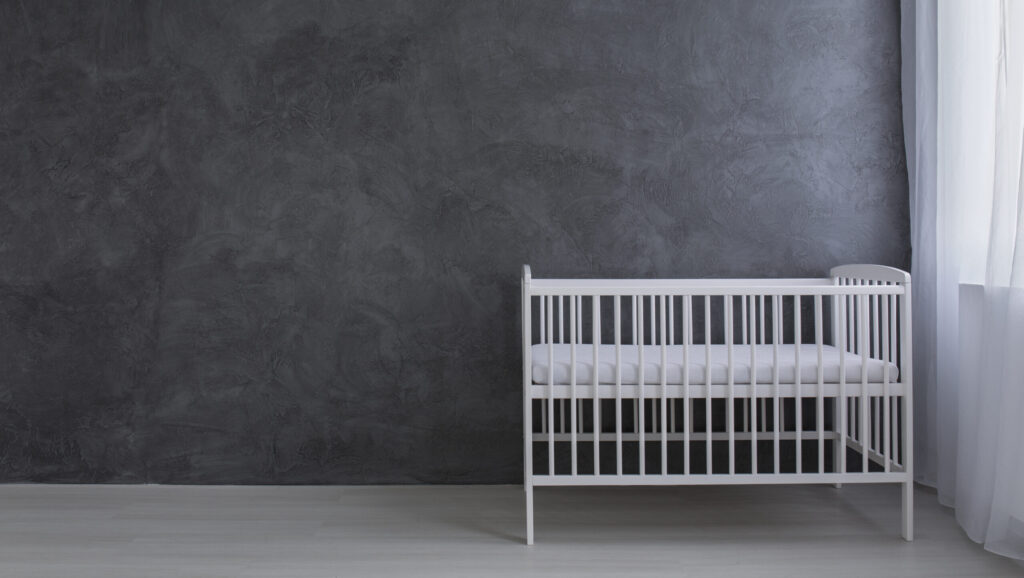 The uncomfortable truth behind extending bereavement leave for miscarriage Shot,Of,A,Little,Bed,In,An,Empty,Grey,Room