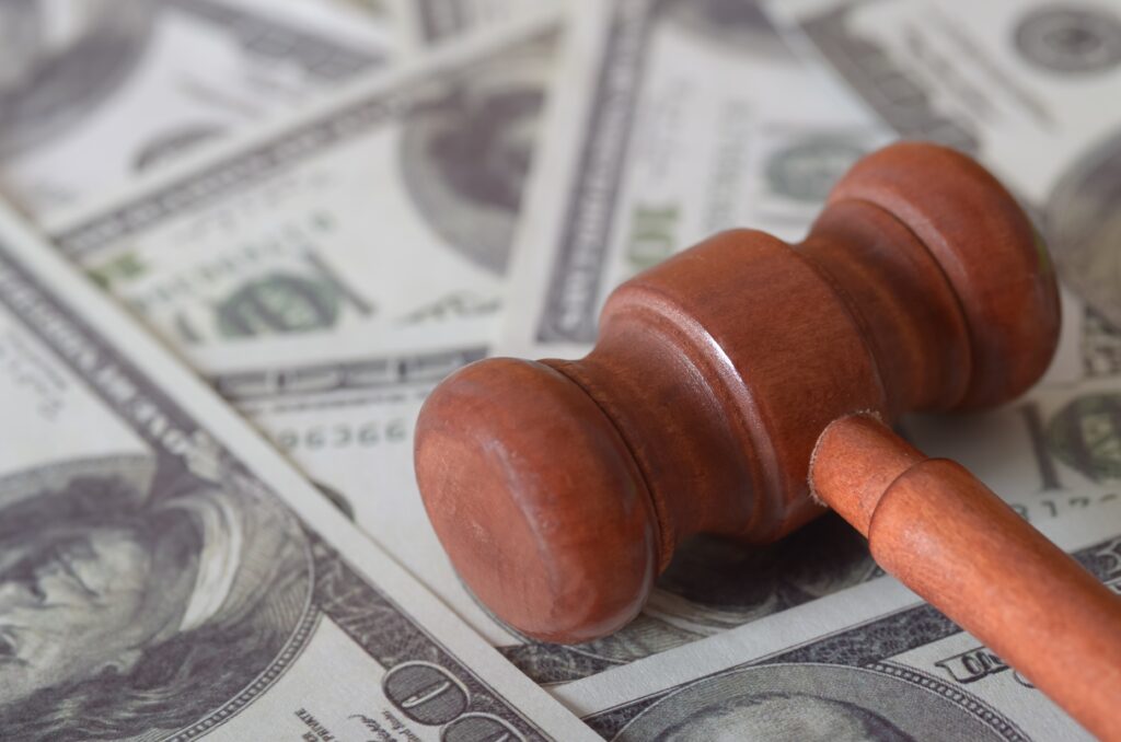 Justice,And,Wealth,Concept:,Wooden,Gavel,On,Us,Dollar,Bills
